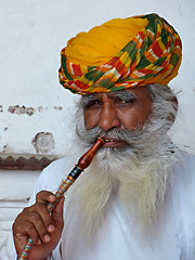 Rajasthani turbaned man smoking pipe