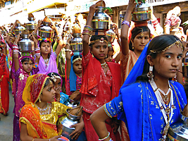 Rajasthani woman in religious procession with gagars on their heads